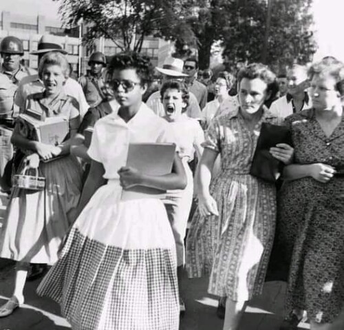 Elizabeth Eckford ignores the screams of students on her first day integrated into a Little Rock Hig